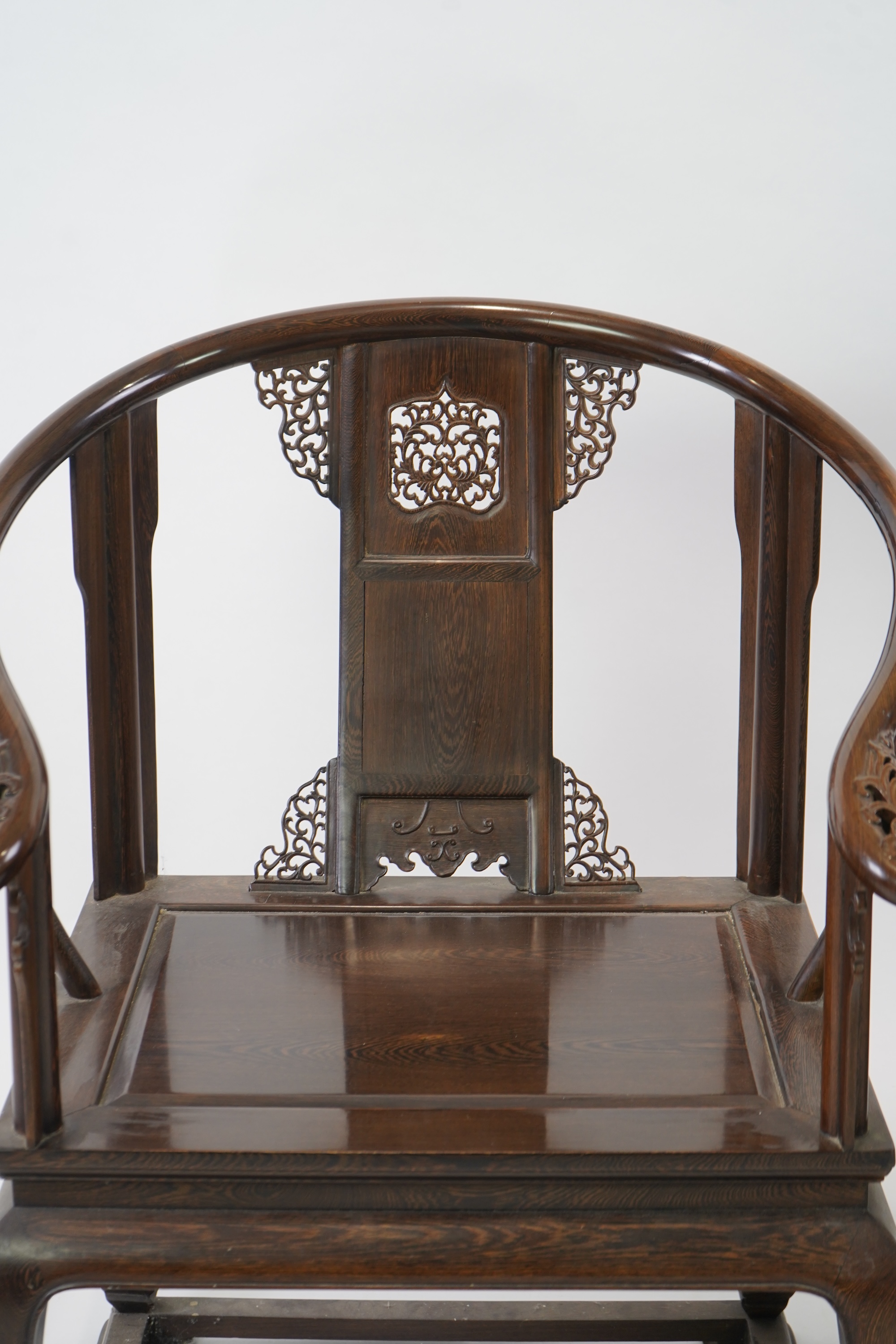 A pair of Chinese jichimu horseshoe shaped armchairs and a matching table, 19th/20th century